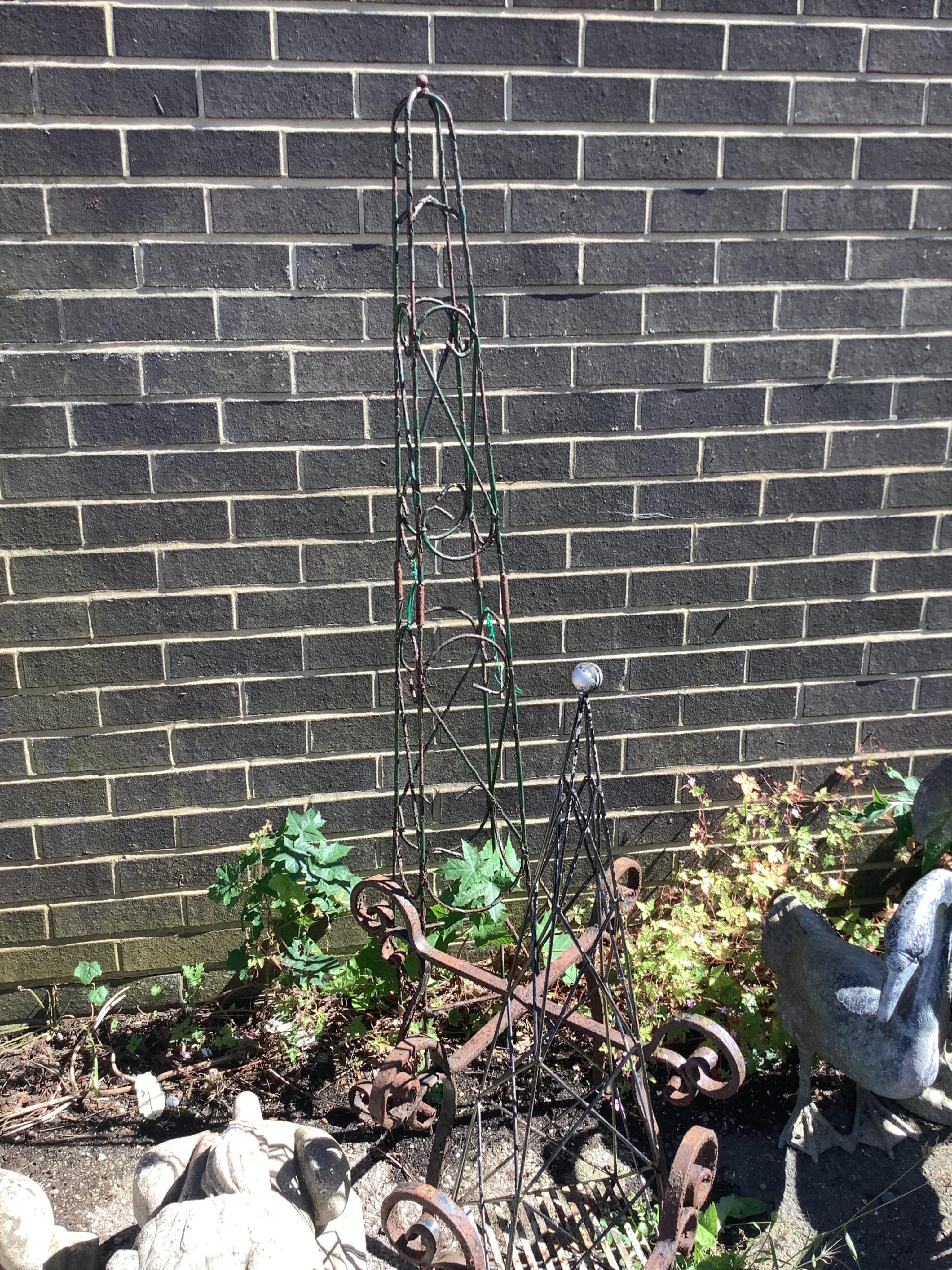 Three wirework garden growing frames, an obelisk and two iron stands, largest height 151cm. Condition - fair